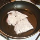 Starting to fry seasoned and floured ox liver.