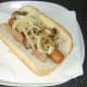 Mushrooms and onion are laid on top of liver and dog.