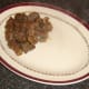 Plating steak, kidney and liver pie filling.