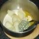 Mashing potatoes with butter, cream and white pepper