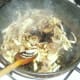 Soy sauce is added to stir fried cabbage and kidneys