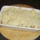 Mashed potato is spooned on to corned beef and cabbage