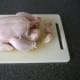 Leg ends and parson's nose are trimmed from chicken