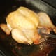 Removing haggis stuffing from roast chicken cavity