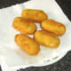 Clapshot croquettes are drained on kitchen paper