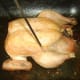 Testing roast chicken for doneness