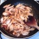 Chicken wings meat is warmed through in sweet chilli sauce