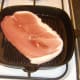 Gammon steak is added to griddle pan