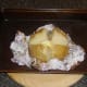 Butter added to cut baked potato
