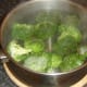 Boiling water and salt added to broccoli florets