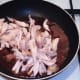 Chicken wings meat is added to sweet chilli sauce