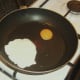 Starting to fry deconstructed egg