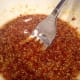 Mix together mustard and maple syrup to create the marinade.