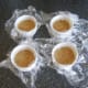 Biscuit crumb base is set in lined ramekins