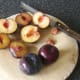 Chopping and de-stoning plums for stewing