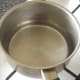 Shallow pan of simmering water