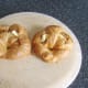 Croissants are slit open and buttered