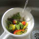 Mediterranean salad is washed in cold water