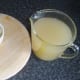 Poaching liquor is poured over conger eel flesh