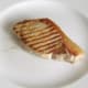 Griddled pork chop is rested