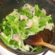 Cabbage and onion are added to lightly sauteed bacon
