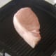 Starting to griddle pork chop