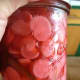 Allow the jars to cool on the counter then put them in the refrigerator. After a week, it's ready. The liquid may turn a pinkish color from the radishes. Open it up and enjoy!