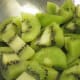 Choose kiwi that are firm enough to thread on the stick.