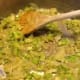 Sauté the onion in butter until tender.