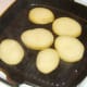 Potato slices are griddled