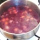 Chicken stock is added to ostrich stew
