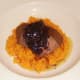 Red wine joux is spooned over ostrich steak