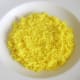 Bed of turmeric spiced rice in serving plate