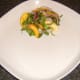 Peach and watercress salad is plated