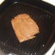 Starting to griddle ostrich steak