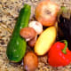 Choose a variety of vegetables to roast. Chop vegetables and garlic.
