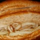 Place onions in hoagie rolls.