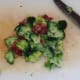 Chopped bacon and broccoli are seasoned with black pepper and combined