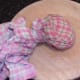 Water is squeezed out of potato in tea towel