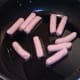 Starting to fry mini sausages