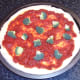 Broccoli is arranged on pizza