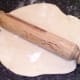 Rolling out pizza dough