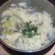 Chopped chives added to mash