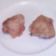 Roasted chicken thighs are left to rest and cool