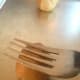 Using a fork's tines, you will want to put the signature cross hash marks into your cookies. This also flattens them down a bit.