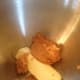 Preheat the oven to 350 degrees. Combine the ground peanuts and butter in the mixing bowl.