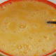 Beat eggs in bowl with salt, pepper, and splash of milk
