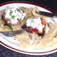 Enjoying Mediterranean vegetables stuffed mushrooms with mozzarella and fusilli