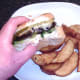 First bite taken from cheese stuffed mushroom burger