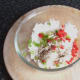Rice, garlic and seasoning is added to cooled rice
